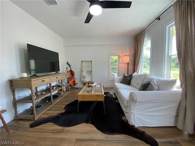 living room with hardwood / wood-style floors and ceiling fan