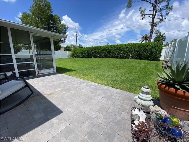 view of patio / terrace with a sunroom