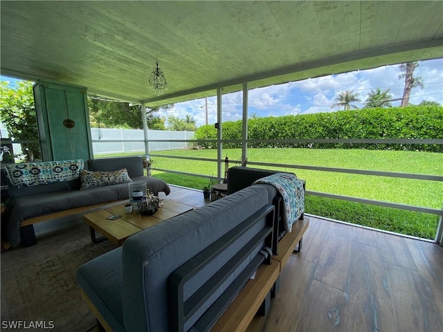 sunroom featuring wood ceiling