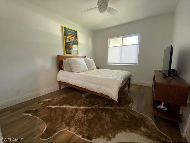 bedroom featuring ceiling fan and dark hardwood / wood-style flooring