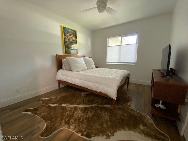 bedroom featuring ceiling fan and dark wood-type flooring