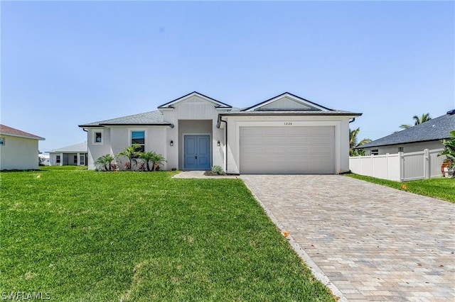 single story home with a front lawn and a garage