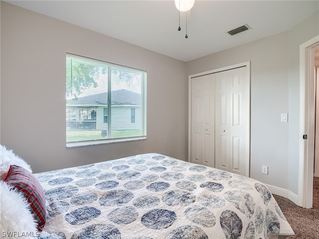 carpeted bedroom with a closet