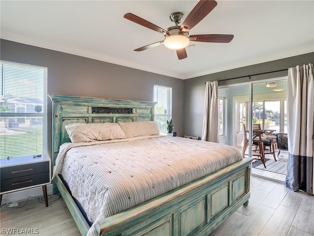 bedroom with crown molding, access to exterior, multiple windows, and light wood-type flooring