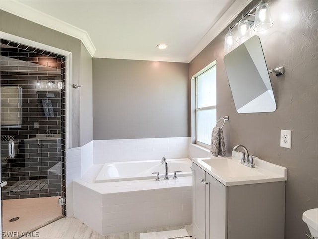 bathroom with crown molding, vanity, and separate shower and tub