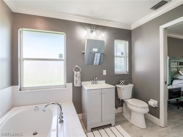 bathroom with toilet, a tub to relax in, vanity, ornamental molding, and hardwood / wood-style flooring