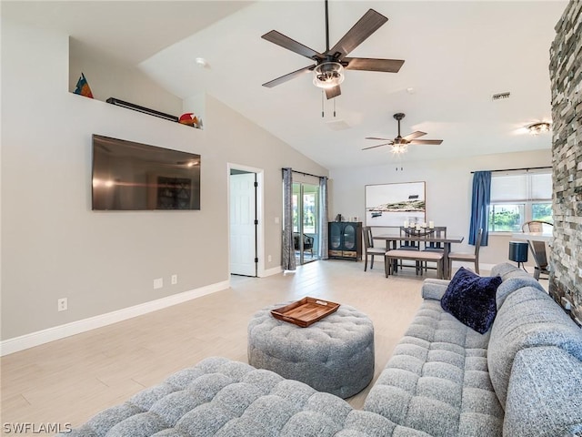 living room featuring ceiling fan, high vaulted ceiling, and light wood-type flooring