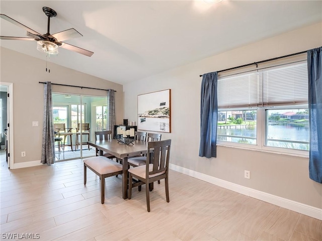 dining area featuring lofted ceiling and ceiling fan