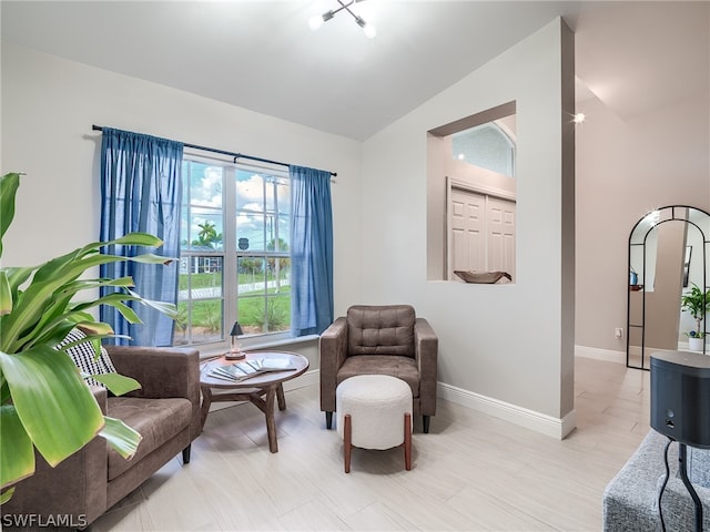 living area featuring vaulted ceiling