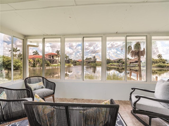 sunroom with a water view and a wealth of natural light