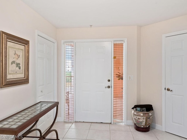 entryway featuring light tile patterned floors