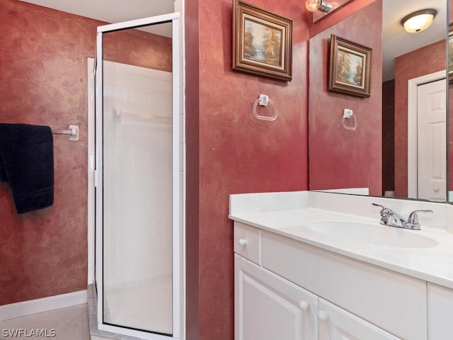 bathroom featuring vanity, tile patterned floors, and a shower with shower door