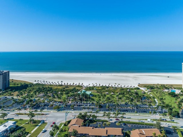 bird's eye view with a water view and a beach view