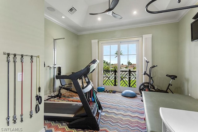 exercise area with ceiling fan and ornamental molding