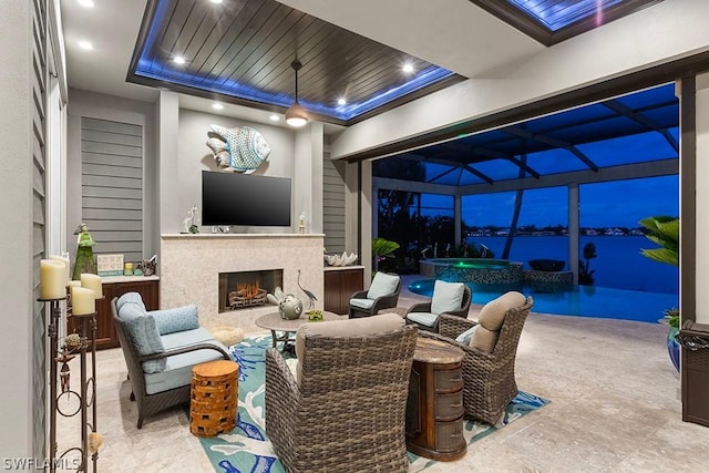 view of patio featuring exterior bar, glass enclosure, and exterior fireplace