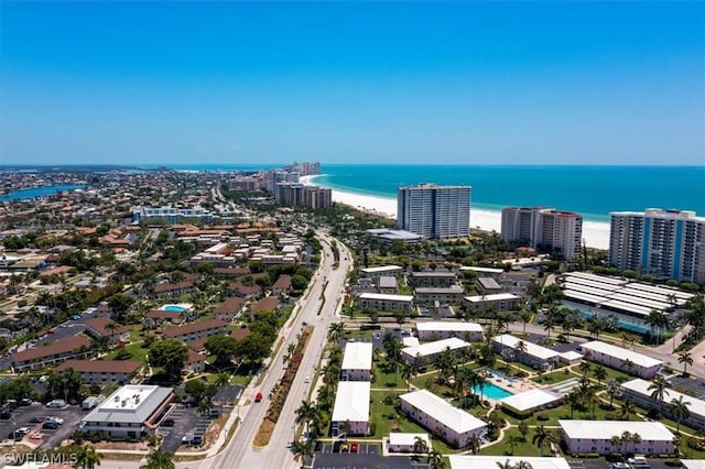 bird's eye view with a view of the beach and a water view