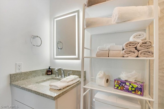 bathroom with vanity and toilet