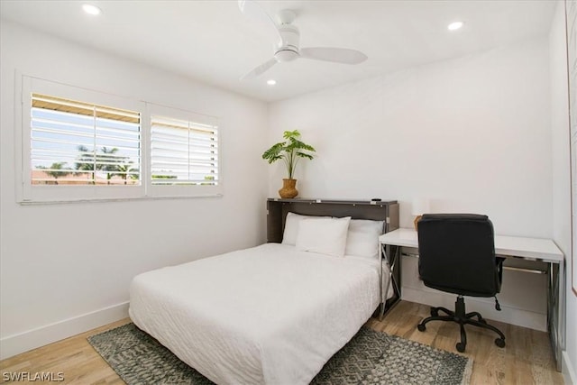 bedroom with ceiling fan and light hardwood / wood-style flooring