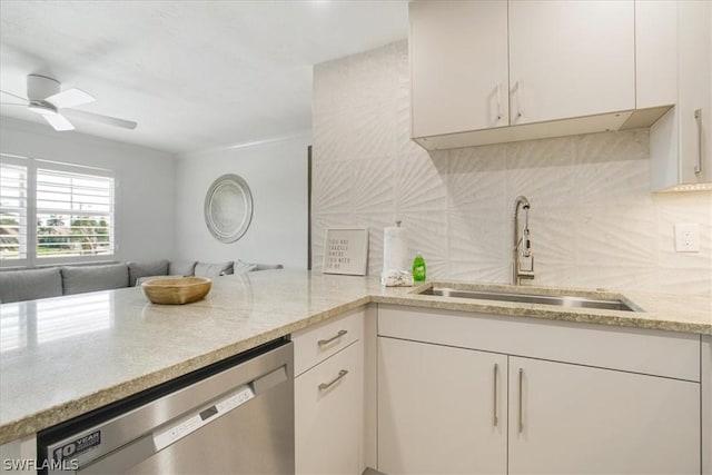 kitchen with sink, dishwasher, ceiling fan, tasteful backsplash, and kitchen peninsula