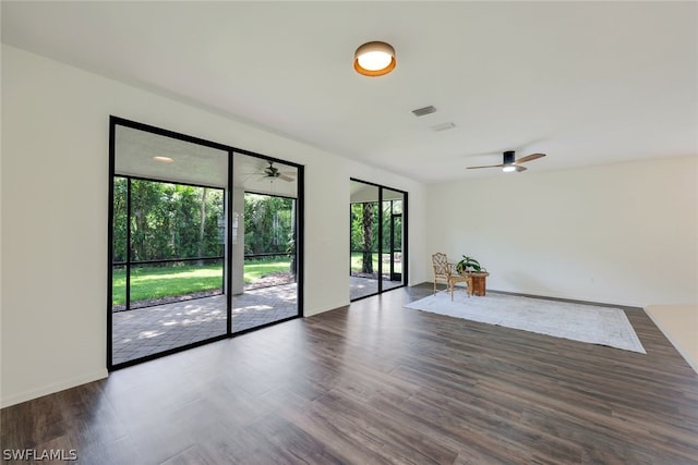 unfurnished room with ceiling fan and wood-type flooring