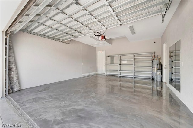 garage featuring a garage door opener and electric water heater