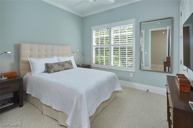 bedroom featuring ornamental molding and light colored carpet