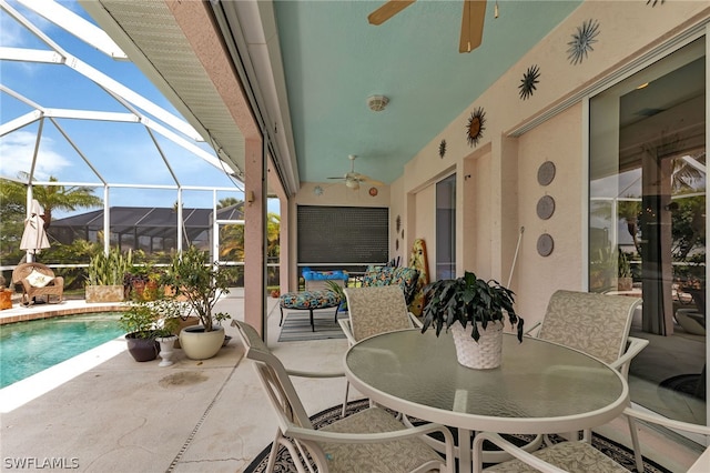 view of patio / terrace with a lanai and ceiling fan