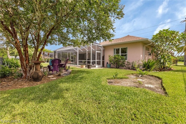 view of yard featuring glass enclosure