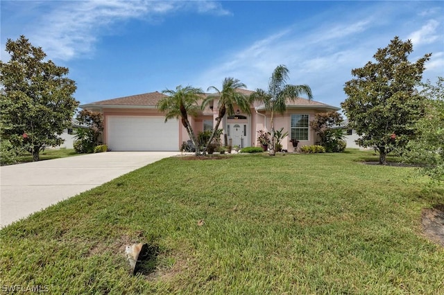 view of front facade with a garage and a front lawn