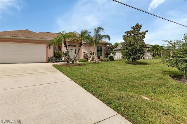 view of front of house featuring a garage and a front lawn