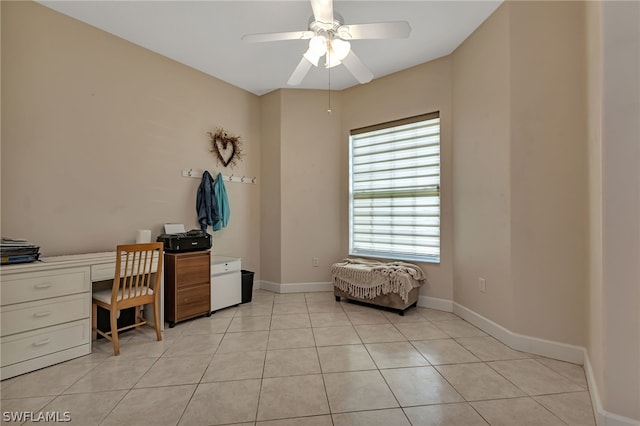 home office with light tile patterned flooring and ceiling fan