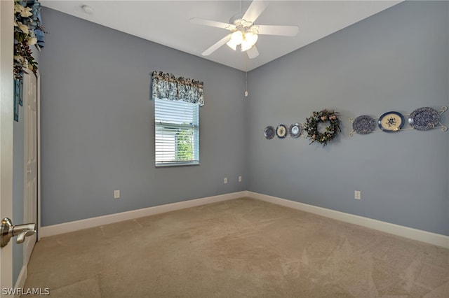 carpeted empty room with ceiling fan