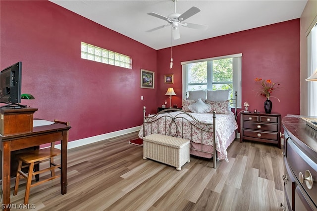 bedroom featuring ceiling fan and light hardwood / wood-style floors