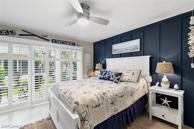 bedroom featuring access to outside, ceiling fan, and light tile patterned floors