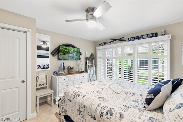 tiled bedroom with ceiling fan