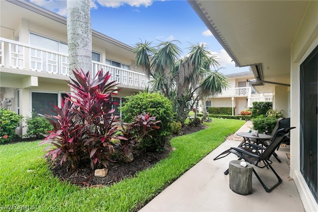 view of patio featuring a balcony