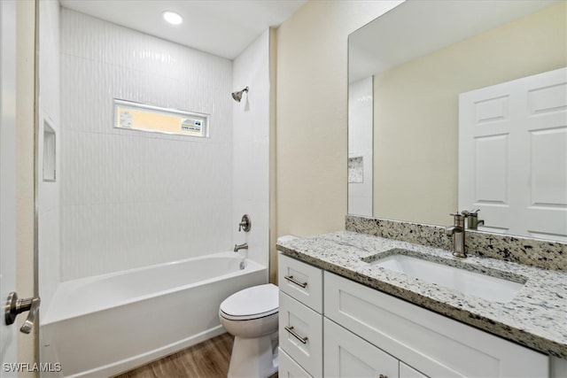 full bathroom with wood-type flooring, vanity, toilet, and shower / bathtub combination