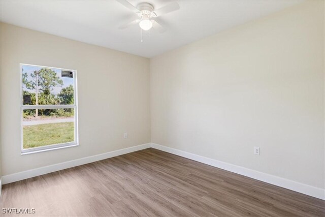 spare room featuring ceiling fan and wood-type flooring