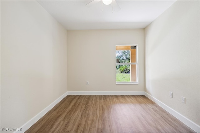 empty room featuring ceiling fan and light hardwood / wood-style flooring