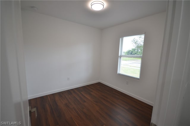 spare room with hardwood / wood-style flooring