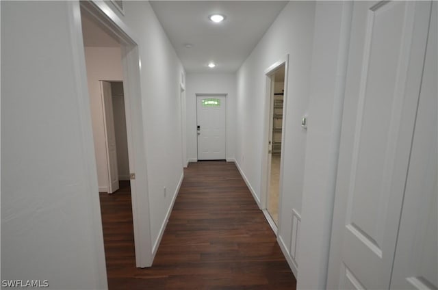 hall with dark hardwood / wood-style floors