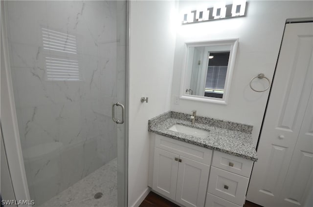 bathroom with vanity and an enclosed shower