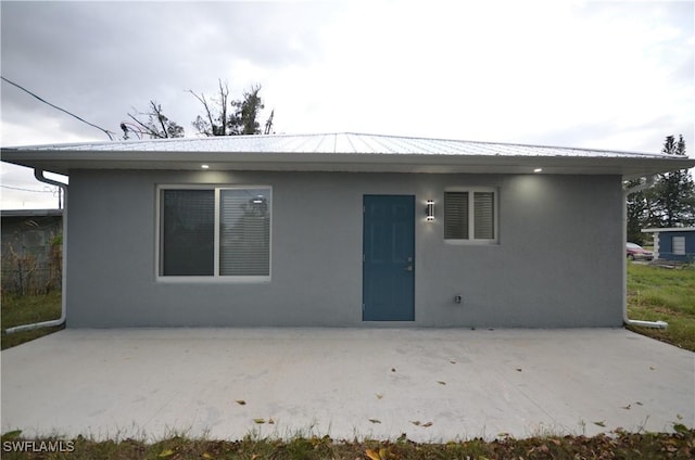 back of house featuring a patio area