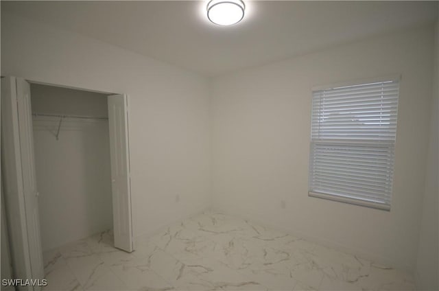 unfurnished bedroom featuring a closet