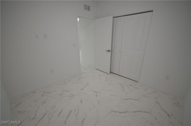 unfurnished bedroom featuring a closet