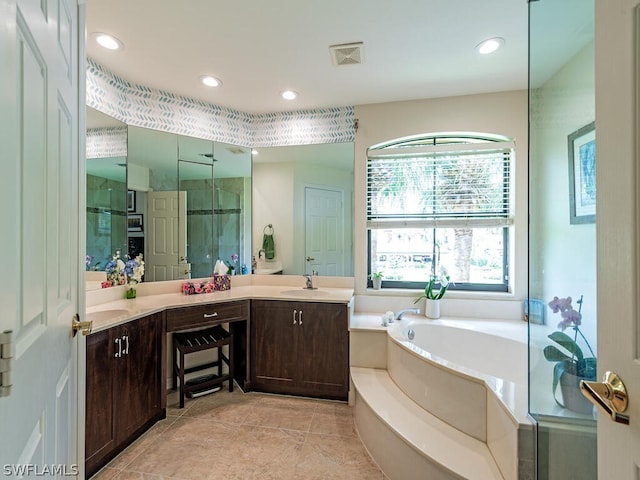 bathroom with vanity and plus walk in shower