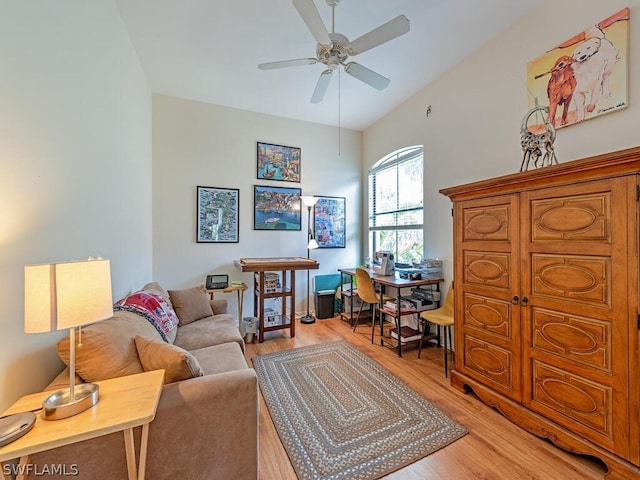 living room featuring ceiling fan and light wood-type flooring