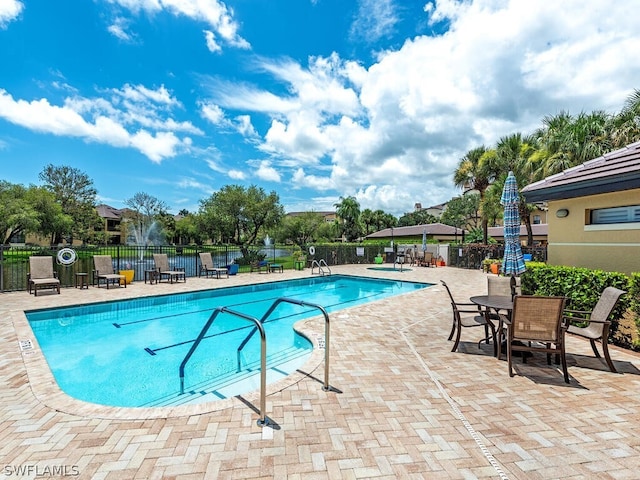 view of swimming pool featuring a patio area