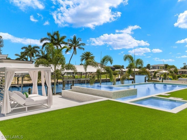 view of pool featuring a water view, a lawn, and an in ground hot tub