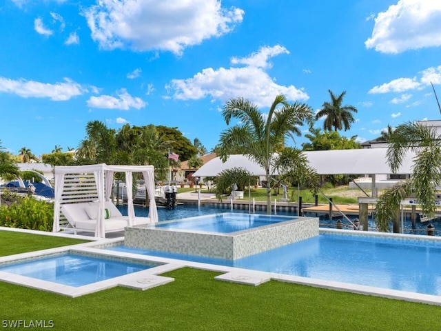 view of pool with an in ground hot tub and a lawn